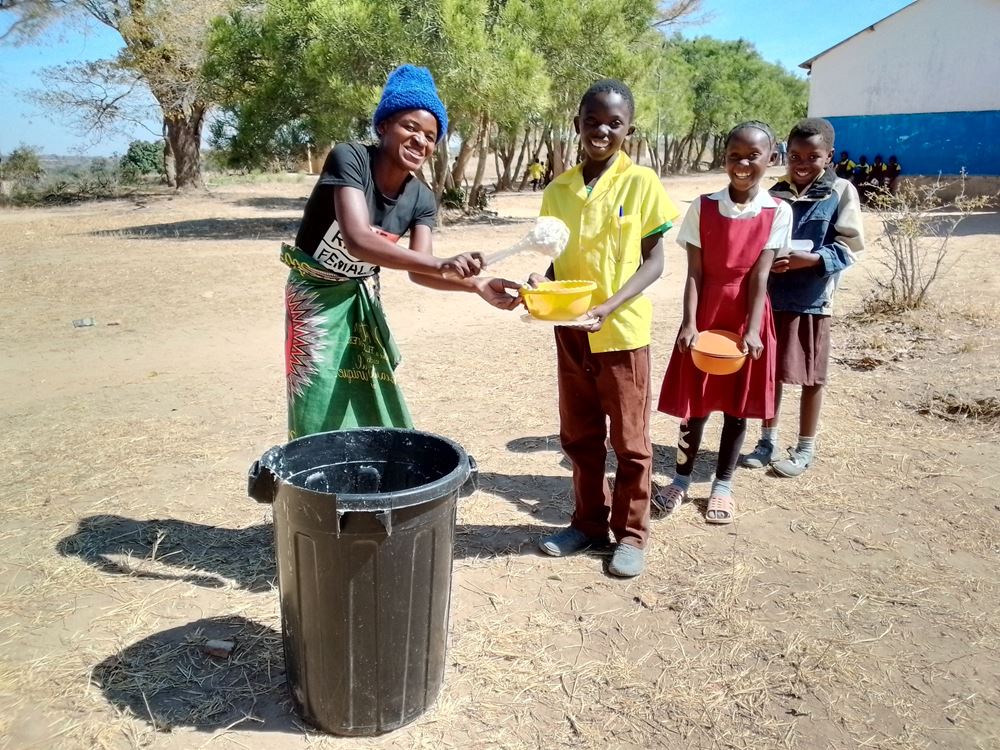 Pupils recieving porridge at Chisikili primary school Pupils recieving porridge at Chisikili primary school